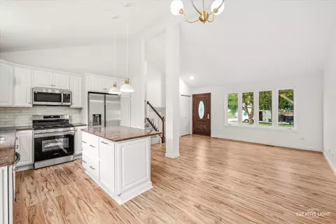Living - 1702 Pebble Beach Dr, Plainfield, IL 60586 photo 1 of 7