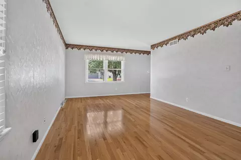 Living - 1204 Searle Dr, Normal, IL 61761 photo 3 of 4