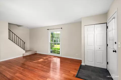 Living - 1681 Ashburn Ct #D, Wheaton, IL 60189 photo 2 of 4
