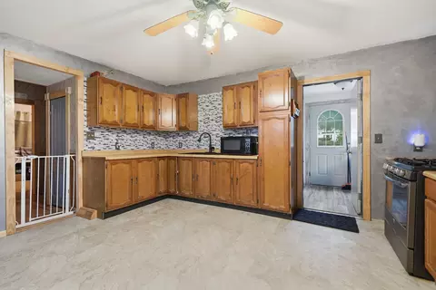 Kitchen - 402 S 1st St, Alpha, IL 61413 photo 2 of 3