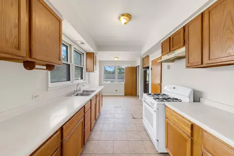 Kitchen - 13 W 37th St, Steger, IL 60475 photo 2 of 3
