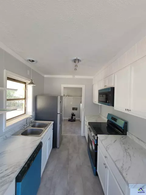 Kitchen - 161 E Cherry St, Cochran, GA 31014 photo 1 of 4