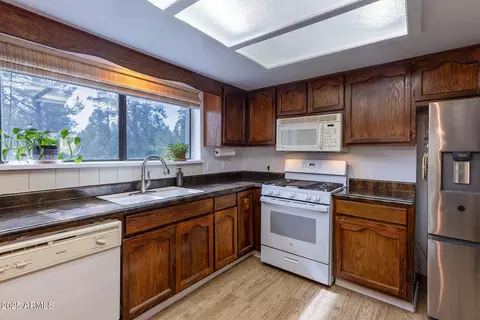 Kitchen - 3334 Whispering Pine Dr, Overgaard, AZ 85933 photo 4 of 5