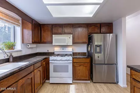 Kitchen - 3334 Whispering Pine Dr, Overgaard, AZ 85933 photo 5 of 5