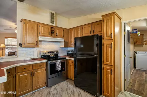 Kitchen - 2893 S Lazy Bear Trl, Overgaard, AZ 85933 photo 3 of 3