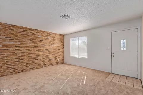 Living - 8640 W Mitchell Dr, Phoenix, AZ 85037 photo 2 of 9
