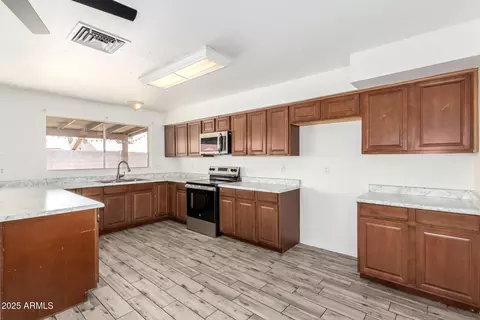 Kitchen - 2551 E Harmony Ave, Mesa, AZ 85204 photo 2 of 3