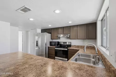 Kitchen - 8652 W Heatherbrae Dr, Phoenix, AZ 85037 photo 2 of 3