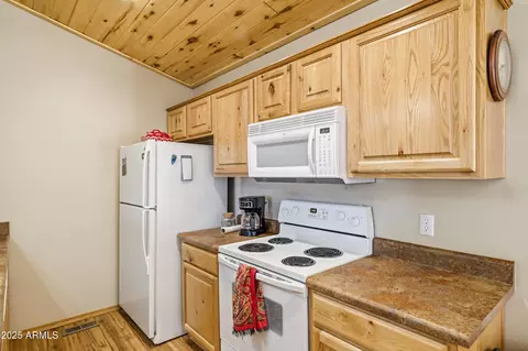 Kitchen - 2348 S Buffalo Loop, Overgaard, AZ 85933 photo 2 of 3