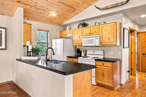 Kitchen - 2332 Buffalo Loop, Overgaard, AZ 85933 photo 2 of 4