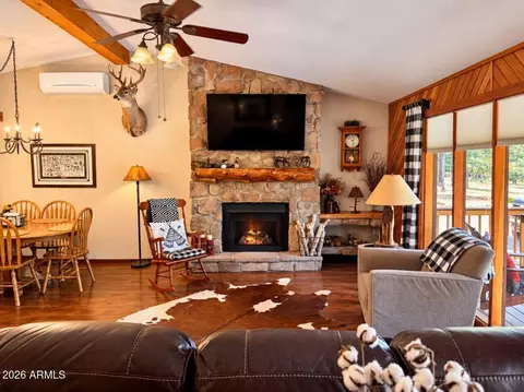 Living - 3346 Whispering Pine Dr, Overgaard, AZ 85933 photo 1 of 2