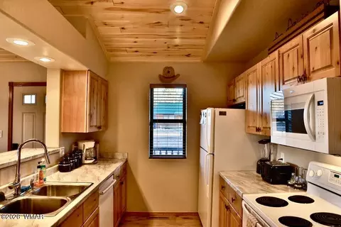 Kitchen - 2334 S Buffalo Loop, Overgaard, AZ 85933 photo 1 of 2