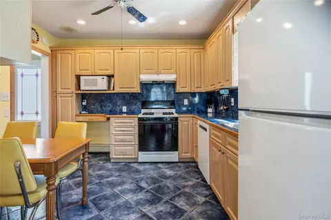 Kitchen - 115 Cedar Ave, Patchogue, NY 11772 photo 1 of 2