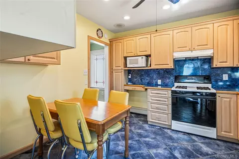Kitchen - 115 Cedar Ave, Patchogue, NY 11772 photo 2 of 2