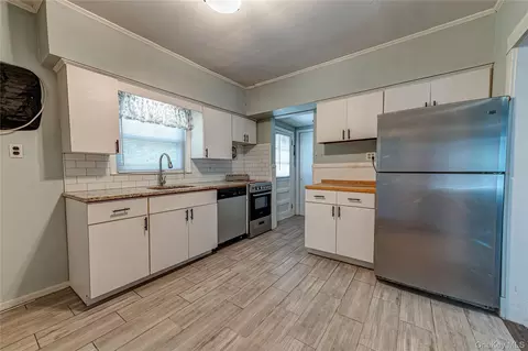 Kitchen - 129 Bay Ave, Patchogue, NY 11772 photo 1 of 2