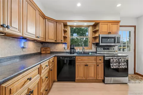 Kitchen - 371 Hewlett Ave, Patchogue, NY 11772 photo 2 of 3