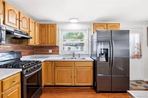 Kitchen - 211 Hampton Ave, Mastic, NY 11950 photo 3 of 4