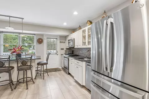Kitchen - 302 Maple Ave, Patchogue, NY 11772 photo 2 of 3