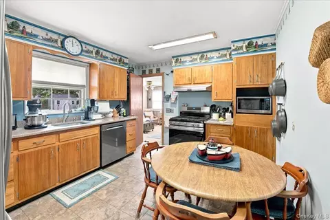 Kitchen - 297 Maple Ave, Patchogue, NY 11772 photo 1 of 2
