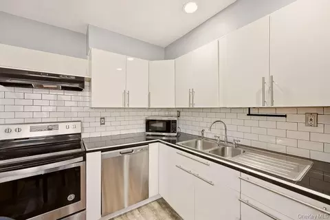 Kitchen - 40 W 4th St #214, Patchogue, NY 11772 photo 1 of 2