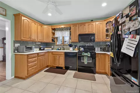 Kitchen - 69 Robert St, Patchogue, NY 11772 photo 2 of 2