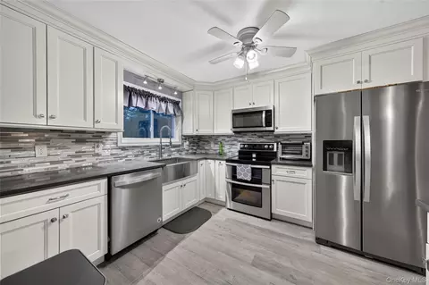 Kitchen - 3 Jasper Ave, Patchogue, NY 11772 photo 2 of 3