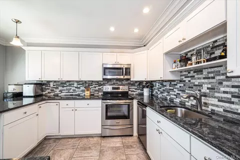 Kitchen - 40 W 4th St #206, Patchogue, NY 11772 photo 2 of 4