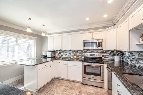 Kitchen - 40 W 4th St #206, Patchogue, NY 11772 photo 1 of 4