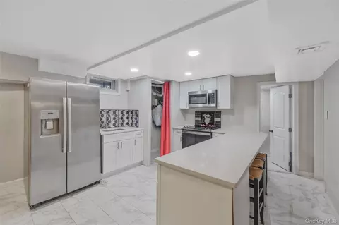 Kitchen - 231 W Woodside Ave, Patchogue, NY 11772 photo 3 of 3