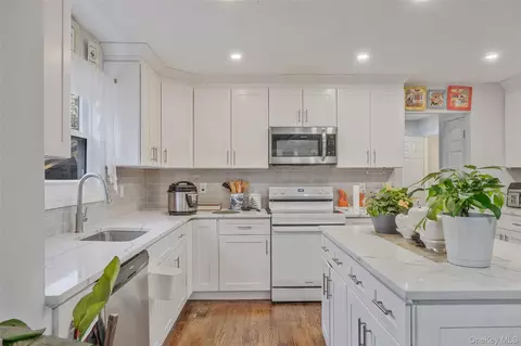 Kitchen - 231 W Woodside Ave, Patchogue, NY 11772 photo 2 of 3