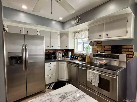 Kitchen - 228 Patchogue Ave, Mastic, NY 11950 photo 1 of 2