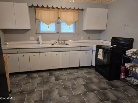 Kitchen - 105 E 6th Ave, Johnstown, NY 12095 photo 3 of 4