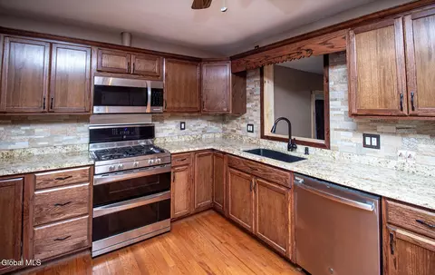 Kitchen - 32 Cinnamon Rdg, Keeseville, NY 12944 photo 2 of 3