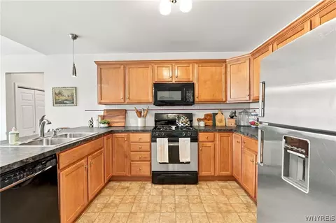 Kitchen - 44 E Home Rd, Bowmansville, NY 14026 photo 3 of 4