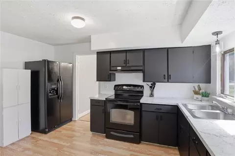 Kitchen - 141 Cooper Rd, Irondequoit, NY 14617 photo 3 of 4