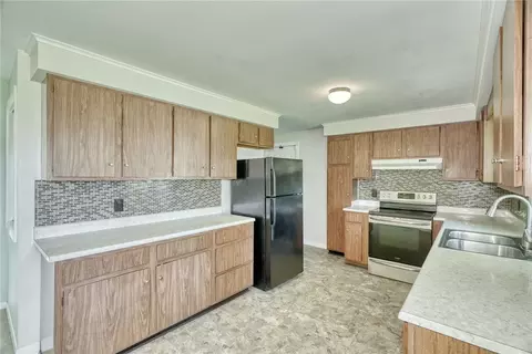Kitchen - 82 Woolacott Rd, Irondequoit, NY 14617 photo 3 of 6