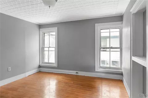 Bedroom - 76 E Genesee St, Auburn, NY 13021 photo 2 of 7
