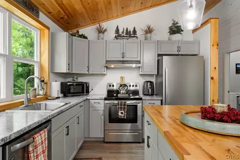 Kitchen - 583 S Shore Rd, Webb, NY 13420 photo 1 of 2