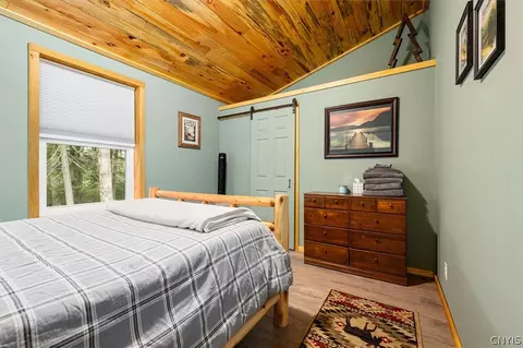Bedroom - 583 S Shore Rd, Webb, NY 13420 photo 3 of 8