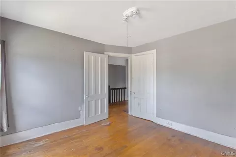 Bedroom - 65 E 7th St, Oswego, NY 13126 photo 6 of 8