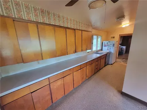 Kitchen - 7670 River Rd, Lysander, NY 13027 photo 2 of 2