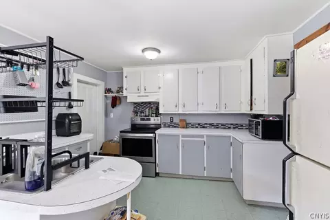Kitchen - 24 Spring St, Schroeppel, NY 13135 photo 3 of 3