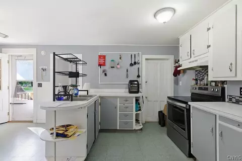Kitchen - 24 Spring St, Schroeppel, NY 13135 photo 2 of 3