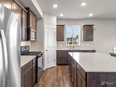 Kitchen - 335 Belfair St SW, Orting, WA 98360 photo 3 of 4
