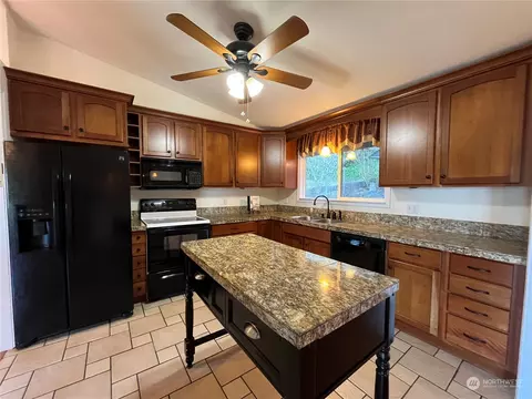 Kitchen - 7441 E Grapeview Loop Rd, Allyn, WA 98524 photo 2 of 3