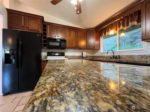 Kitchen - 7441 E Grapeview Loop Rd, Allyn, WA 98524 photo 3 of 3