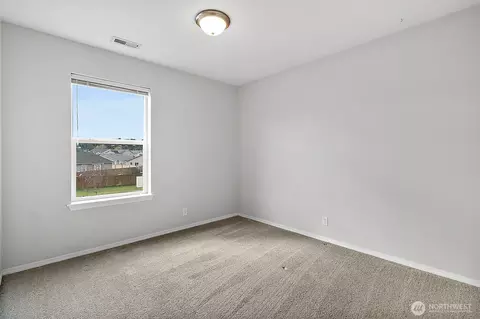Bedroom - 1002 Daffodil Ave NE, Orting, WA 98360 photo 2 of 7