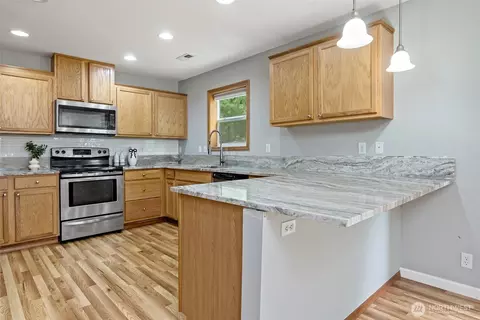 Kitchen - 908 Daffodil Ave NE, Orting, WA 98360 photo 1 of 3