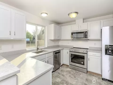 Kitchen - 413 Kensington Ave NW, Orting, WA 98360 photo 2 of 2