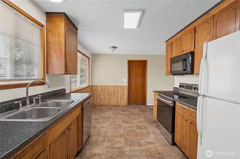 Kitchen - 1211 196th St E, Spanaway, WA 98387 photo 2 of 4
